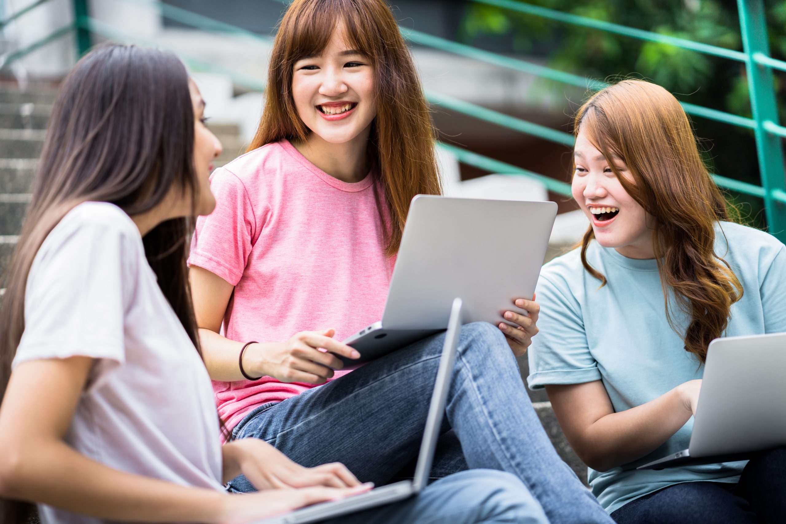 group,of,happy,teen,high,school,students,outdoors